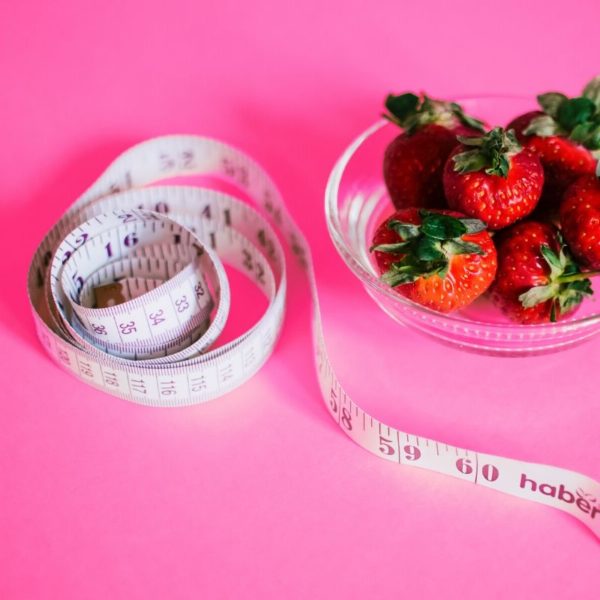 measuring tape and strawberries